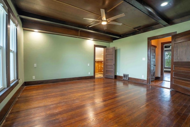 2950 Ranch Road 33, Big Spring, TX 79720 - spare room featuring wood-type flooring, beamed ceiling, and a ceiling fan