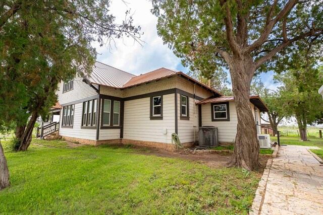 2950 Ranch Road 33, Big Spring, TX 79720 - view of side of property with a lawn and a metal roof
