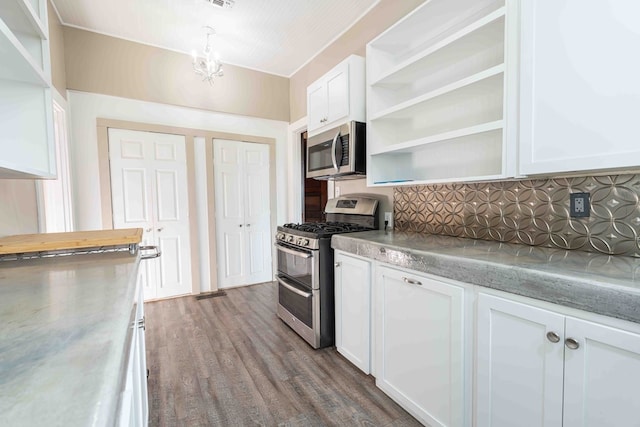 2950 Ranch Road 33, Big Spring, TX 79720 - kitchen featuring appliances with stainless steel finishes, open shelves, and white cabinetry