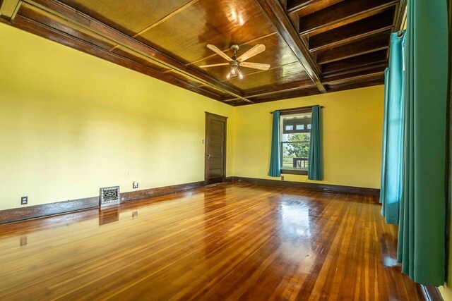2950 Ranch Road 33, Big Spring, TX 79720 - spare room featuring wooden ceiling, dark wood-style flooring, a ceiling fan, and coffered ceiling
