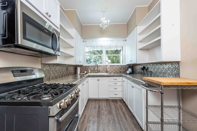 2950 Ranch Road 33, Big Spring, TX 79720 - kitchen with open shelves, appliances with stainless steel finishes, white cabinetry, dark wood-style flooring, and backsplash