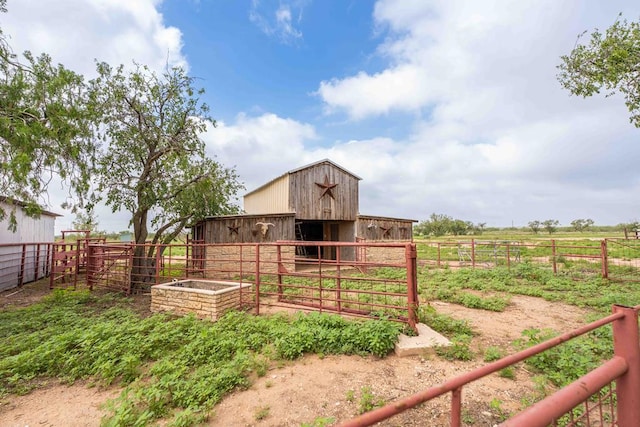 2950 Ranch Road 33, Big Spring, TX 79720 - view of yard featuring an exterior structure, an outdoor structure, and a view of countryside