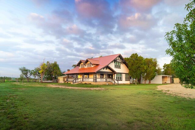 2950 Ranch Road 33, Big Spring, TX 79720 - back of house featuring a yard, a metal roof, and covered porch
