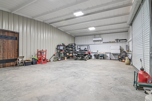 garage with a wall mounted air conditioner and metal wall