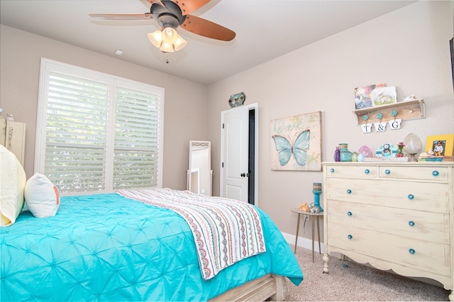 bedroom featuring baseboards, a ceiling fan, and carpet floors