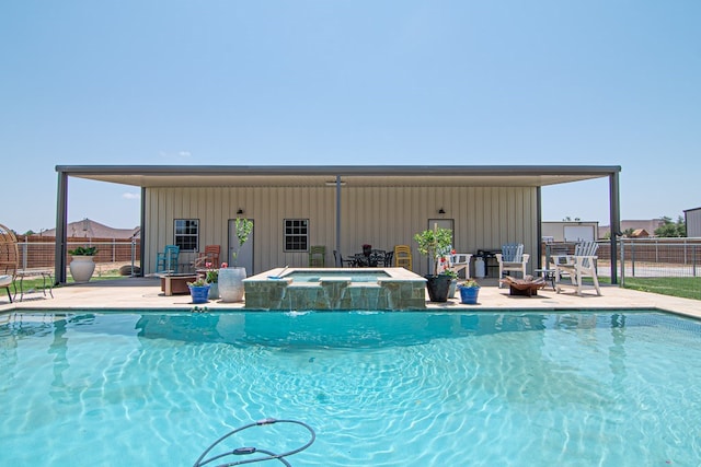 view of pool featuring an in ground hot tub, fence, and a fenced in pool