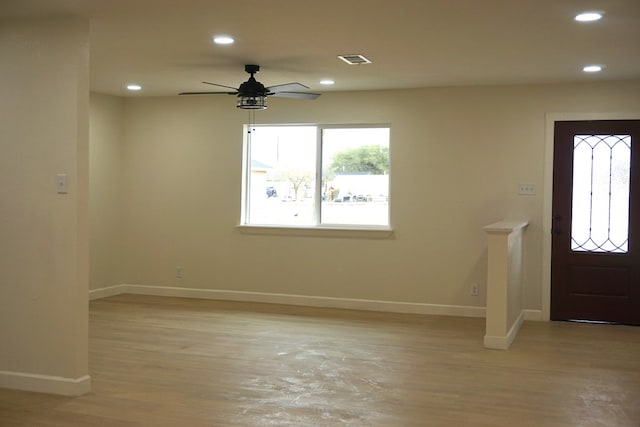 foyer entrance featuring light hardwood / wood-style floors and ceiling fan