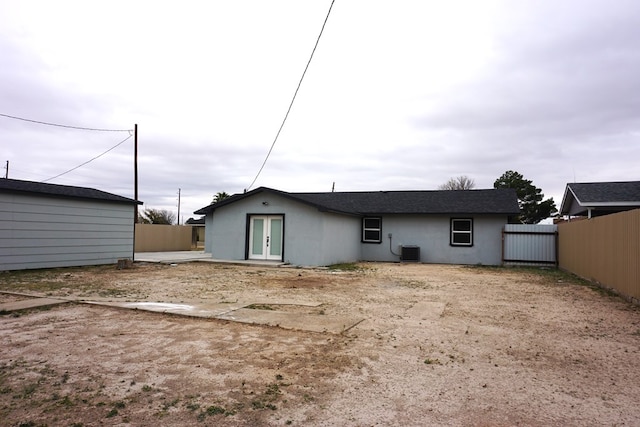 back of property featuring french doors and cooling unit