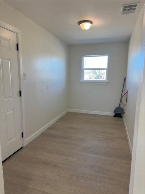 unfurnished room featuring light wood-type flooring