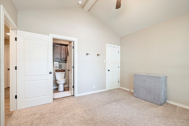 unfurnished bedroom with beam ceiling, ensuite bathroom, ceiling fan, and light carpet