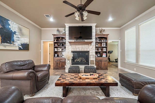 living room with a stone fireplace and ornamental molding