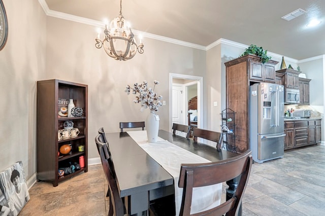 dining area with a chandelier and crown molding