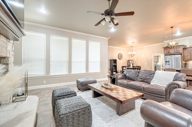 living room featuring ceiling fan with notable chandelier and ornamental molding