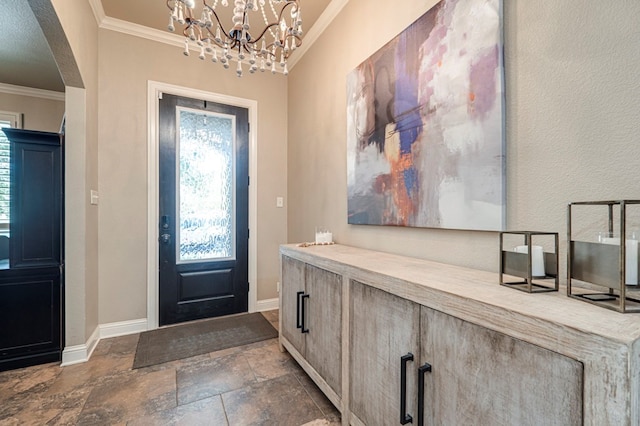 entrance foyer featuring a chandelier and ornamental molding