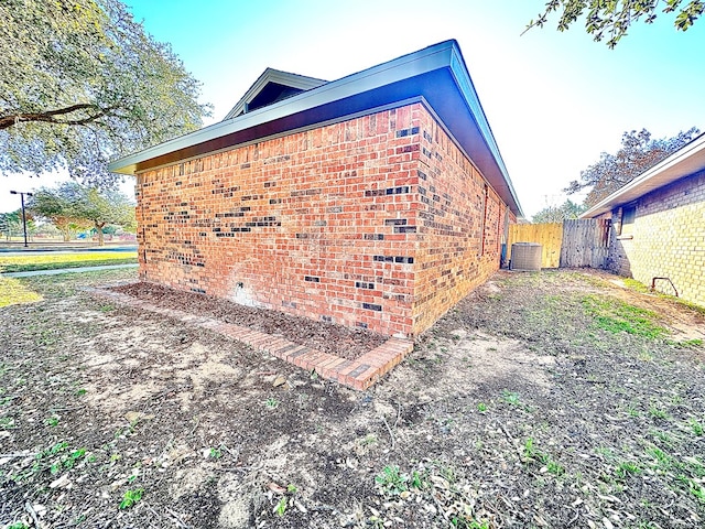 view of side of property with central AC