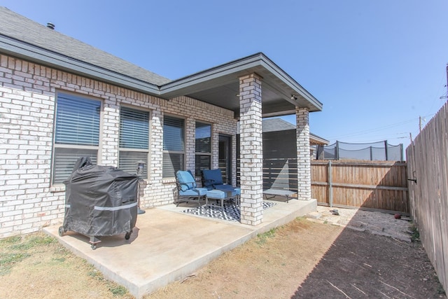 view of patio featuring area for grilling and fence private yard