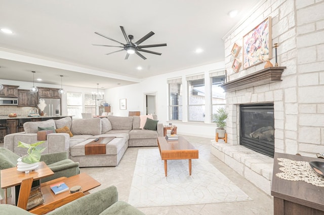 living area featuring recessed lighting, a fireplace, and light tile patterned floors