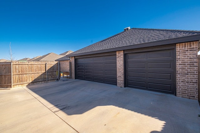 garage featuring fence