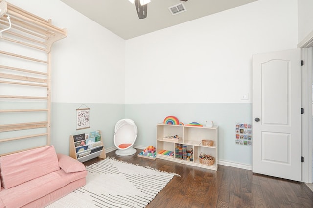 game room with visible vents, ceiling fan, baseboards, and wood finished floors