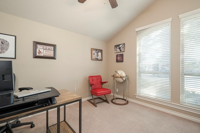 office space with carpet floors, lofted ceiling, baseboards, and a ceiling fan