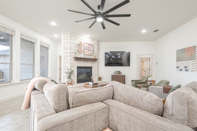 living area with ornamental molding, a fireplace, and recessed lighting