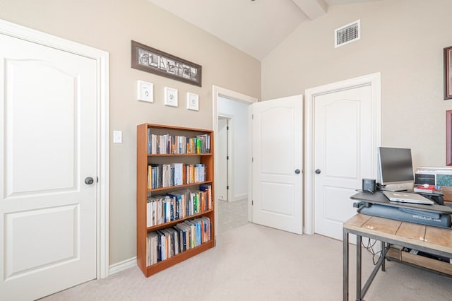 home office featuring vaulted ceiling with beams, carpet floors, and visible vents