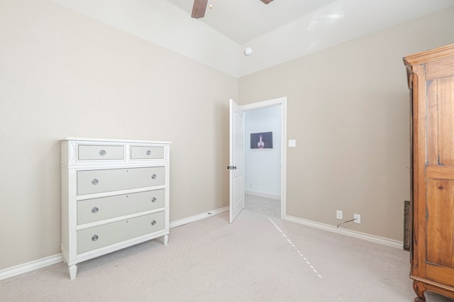 bedroom featuring baseboards, a ceiling fan, and light colored carpet