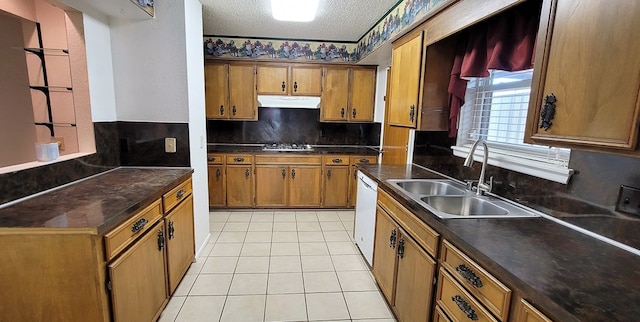 kitchen with tasteful backsplash, a textured ceiling, sink, light tile patterned floors, and dishwasher