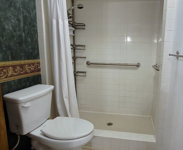 bathroom with a shower with curtain and toilet