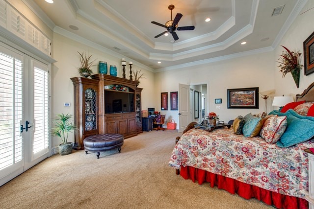 carpeted bedroom featuring ceiling fan, a raised ceiling, access to outside, french doors, and crown molding