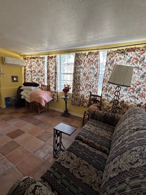 5038 N Sullivan Rd, Fort Stockton, TX 79735 - living room featuring a textured ceiling and a wall mounted AC