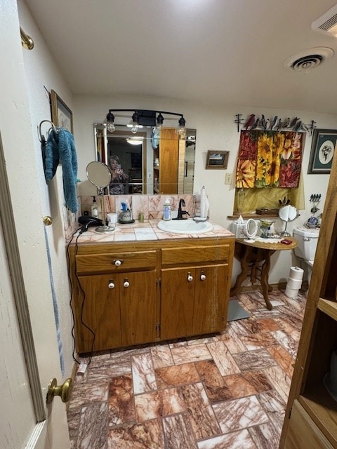 5038 N Sullivan Rd, Fort Stockton, TX 79735 - bathroom with toilet and vanity