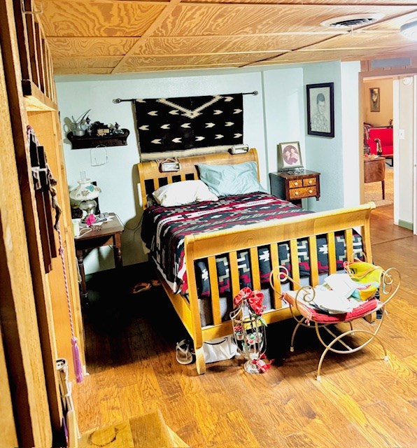 5038 N Sullivan Rd, Fort Stockton, TX 79735 - bedroom with wood finished floors and an ornate ceiling