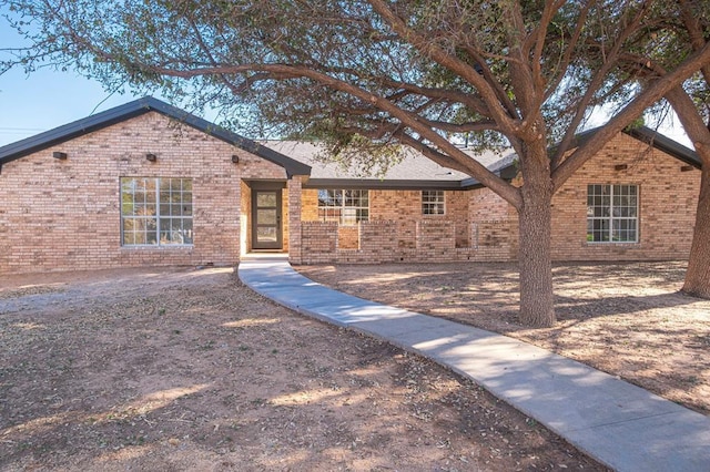 ranch-style house with brick siding