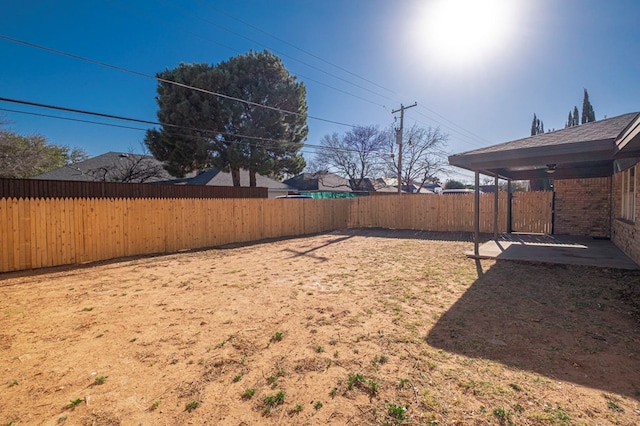 view of yard with a fenced backyard and a patio