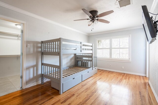 1606 Harvard Ave, Midland, TX 79701 - unfurnished bedroom featuring hardwood / wood-style flooring, baseboards, and ornamental molding