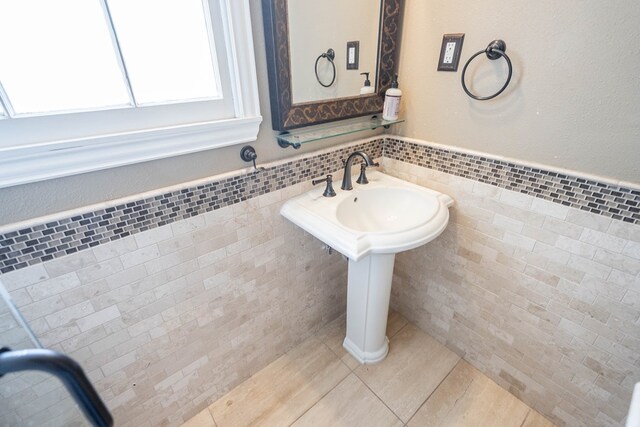 1606 Harvard Ave, Midland, TX 79701 - bathroom featuring tile walls, tile patterned flooring, and wainscoting