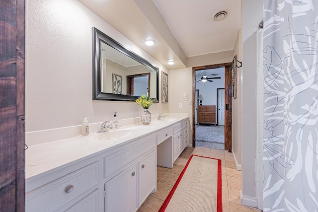 bathroom with ceiling fan, vanity, and tile patterned flooring