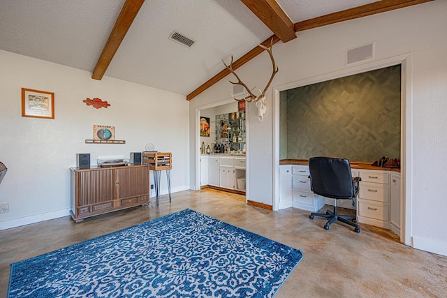 office area with vaulted ceiling with beams and a textured ceiling