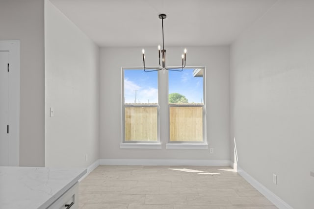 2710 Beachwood St, Midland, TX 79706 - unfurnished dining area with a chandelier and baseboards