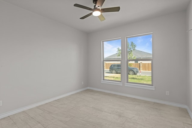2710 Beachwood St, Midland, TX 79706 - spare room with ceiling fan and baseboards