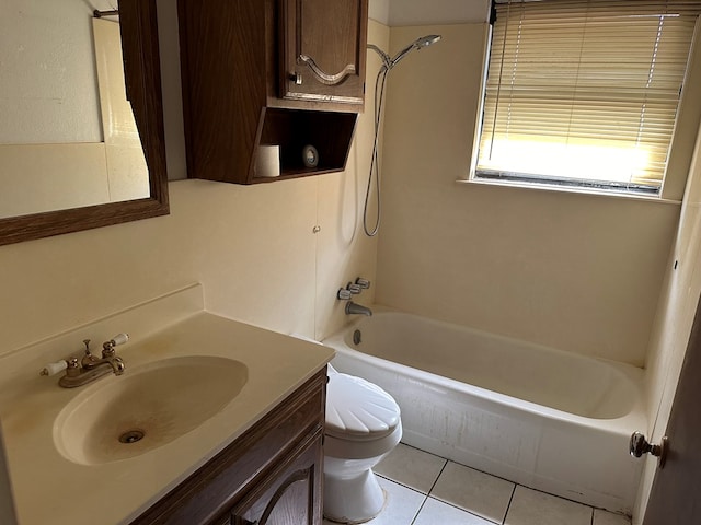 full bathroom with vanity, tile patterned floors, washtub / shower combination, and toilet