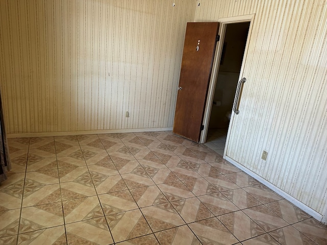 spare room with light tile patterned floors