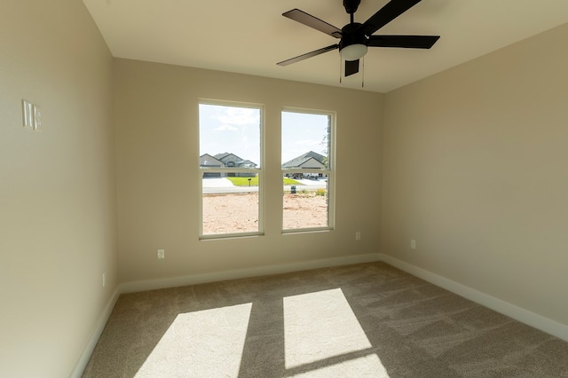 2209 S County Rd 1059, Midland, TX 79706 - carpeted spare room with baseboards and ceiling fan