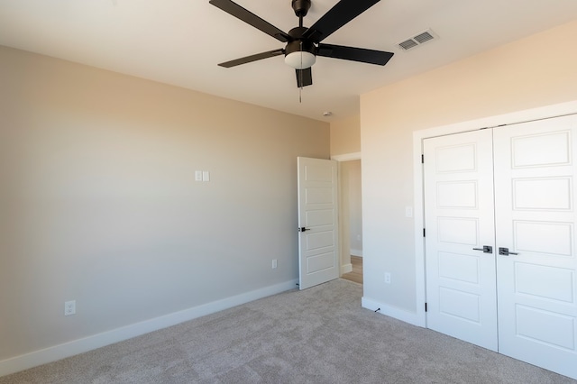 2209 S County Rd 1059, Midland, TX 79706 - unfurnished bedroom featuring carpet flooring, a closet, baseboards, and ceiling fan