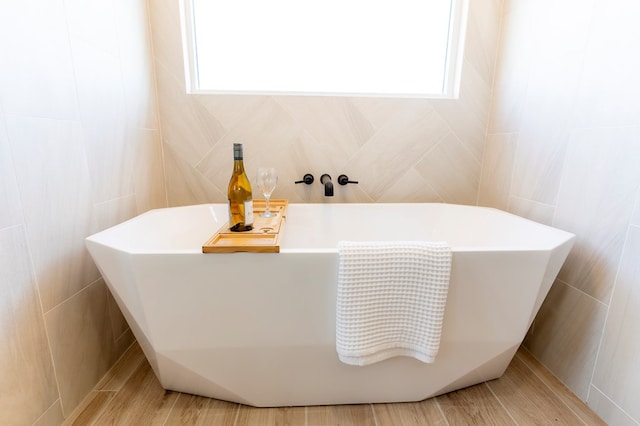 2209 S County Rd 1059, Midland, TX 79706 - full bathroom featuring tile walls and a soaking tub