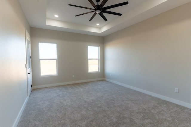 2209 S County Rd 1059, Midland, TX 79706 - empty room with ceiling fan, a raised ceiling, baseboards, and recessed lighting