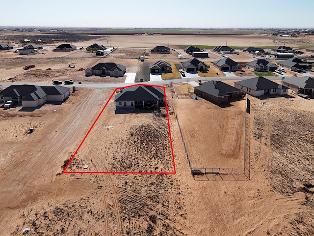 drone / aerial view with a desert view and a rural view