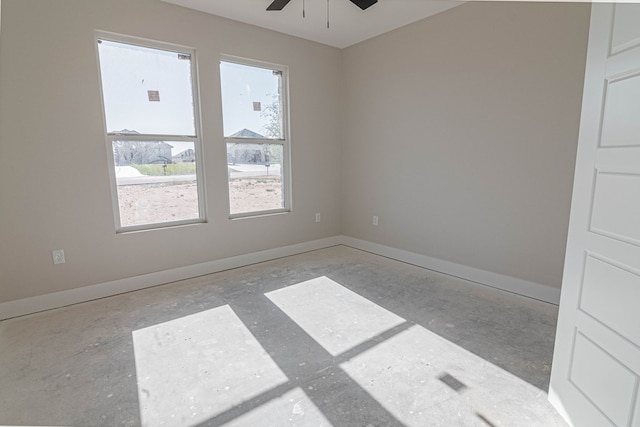 empty room with baseboards and a ceiling fan