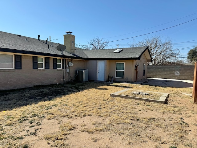 back of house featuring cooling unit and a patio